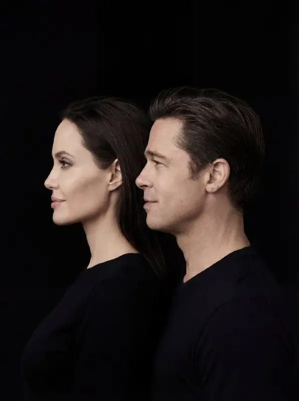 Elegant side profile portrait of a couple on black background