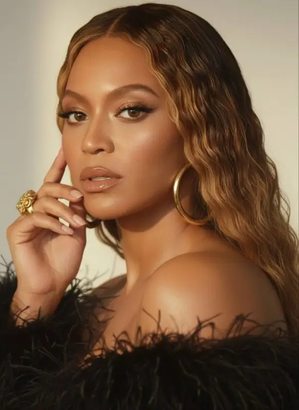 Elegant Woman in Glamorous Feathered Dress Portrait