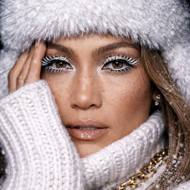 Close-up Portrait of Woman in Glamorous Winter White Outfit