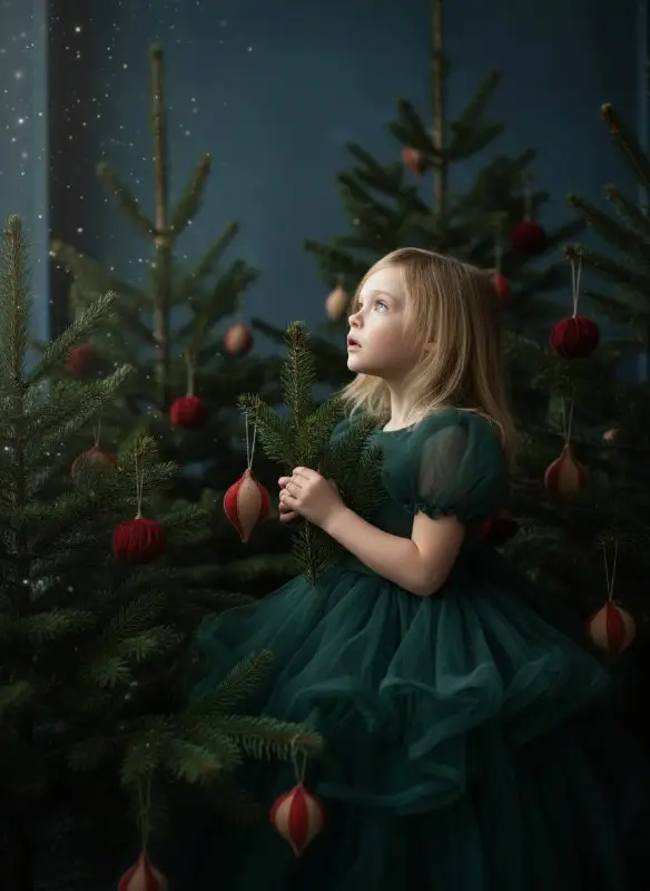 Little Girl in Green Tulle Dress Among Christmas Trees