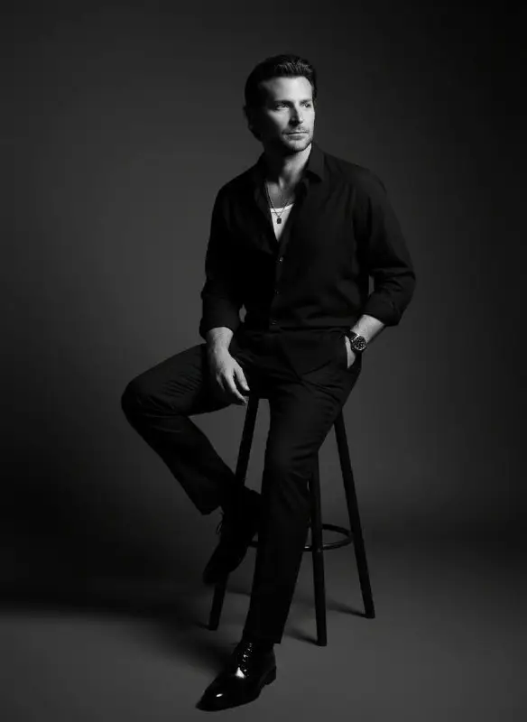 Dramatic Black and White Studio Portrait of a Man Sitting