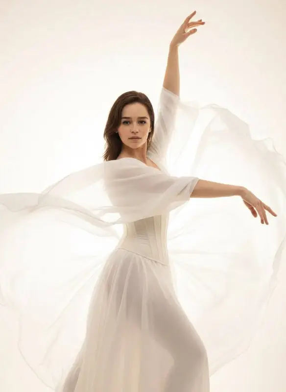 Elegant Woman in Flowing White Dress with Ethereal Dance Pose