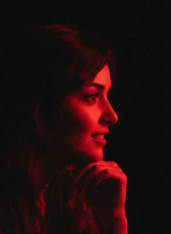Side Profile Portrait of a Woman with Moody Red Lighting