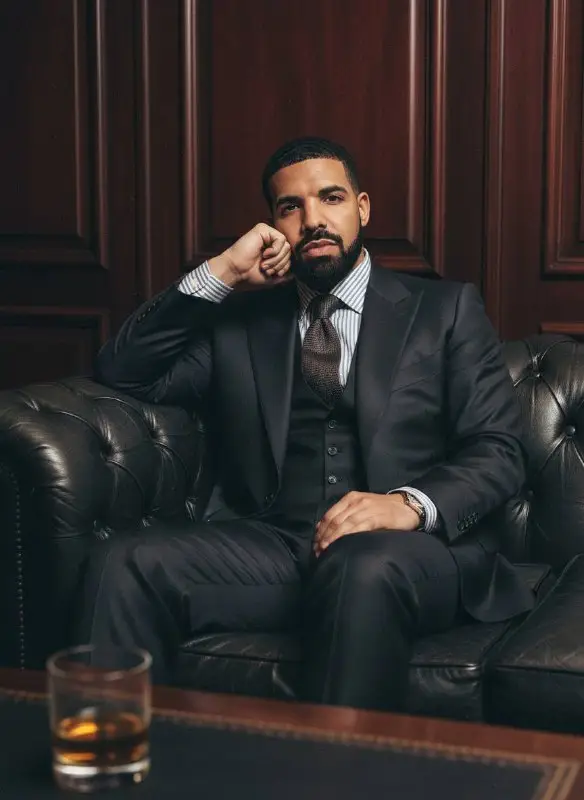 Sophisticated Man in Three Piece Suit on Leather Sofa