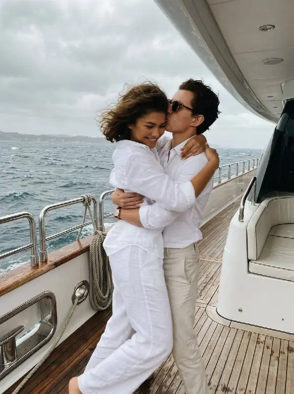 Romantic Couple Embracing on a Luxury Yacht During Sea Vacation