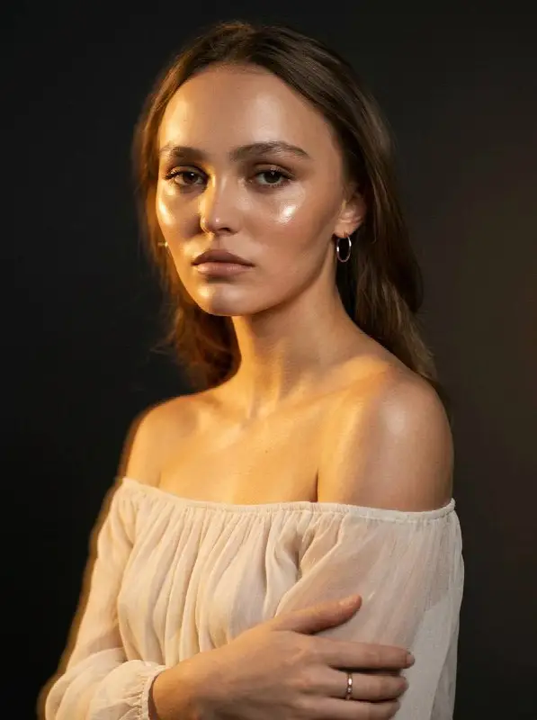 Cinematic portrait of young woman wearing off-the-shoulder white top