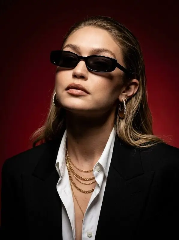 Stylish Woman in Black Blazer and Sunglasses Portrait